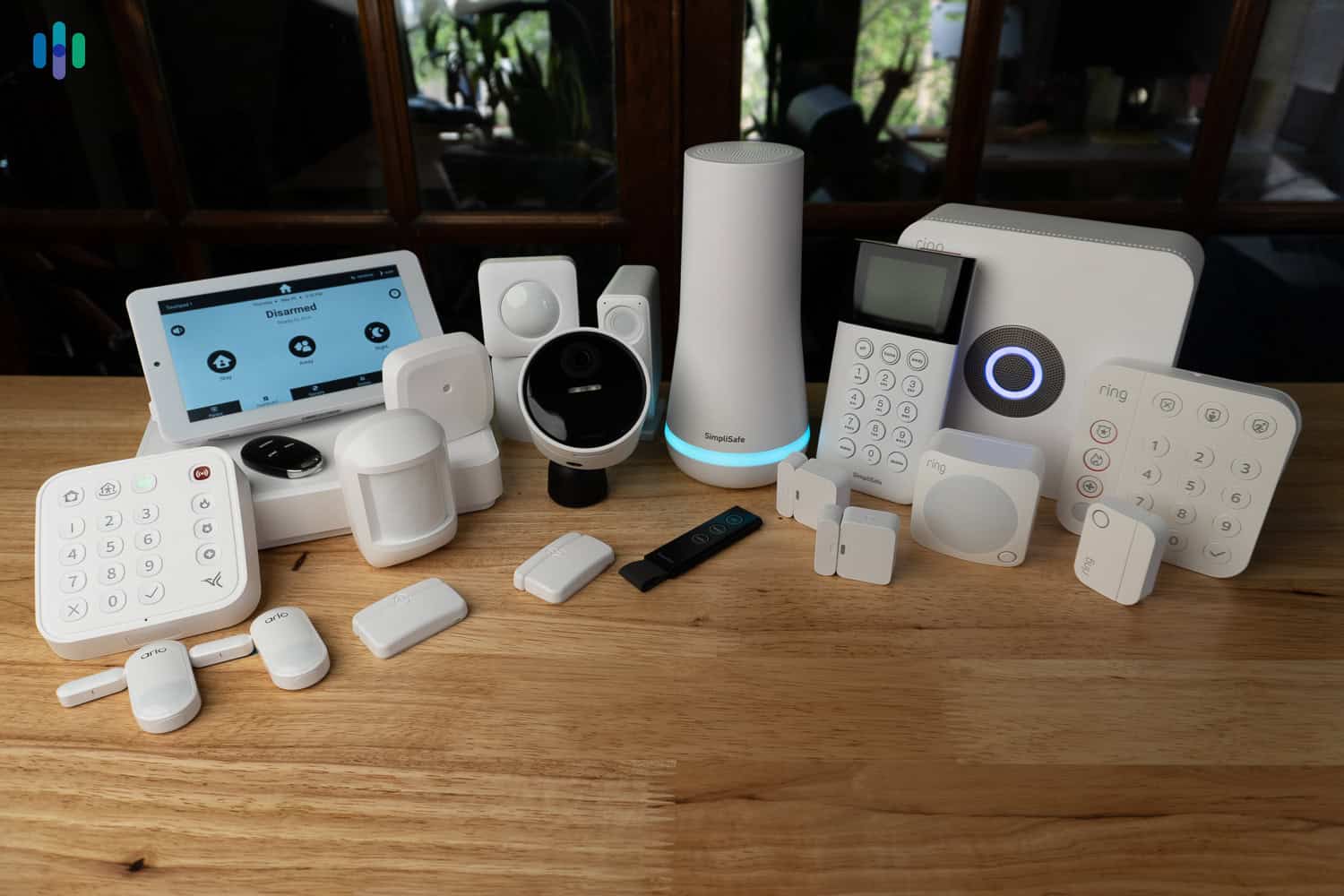 Lineup of the security systems we've tested (Arlo, SimpliSafe, and Ring)