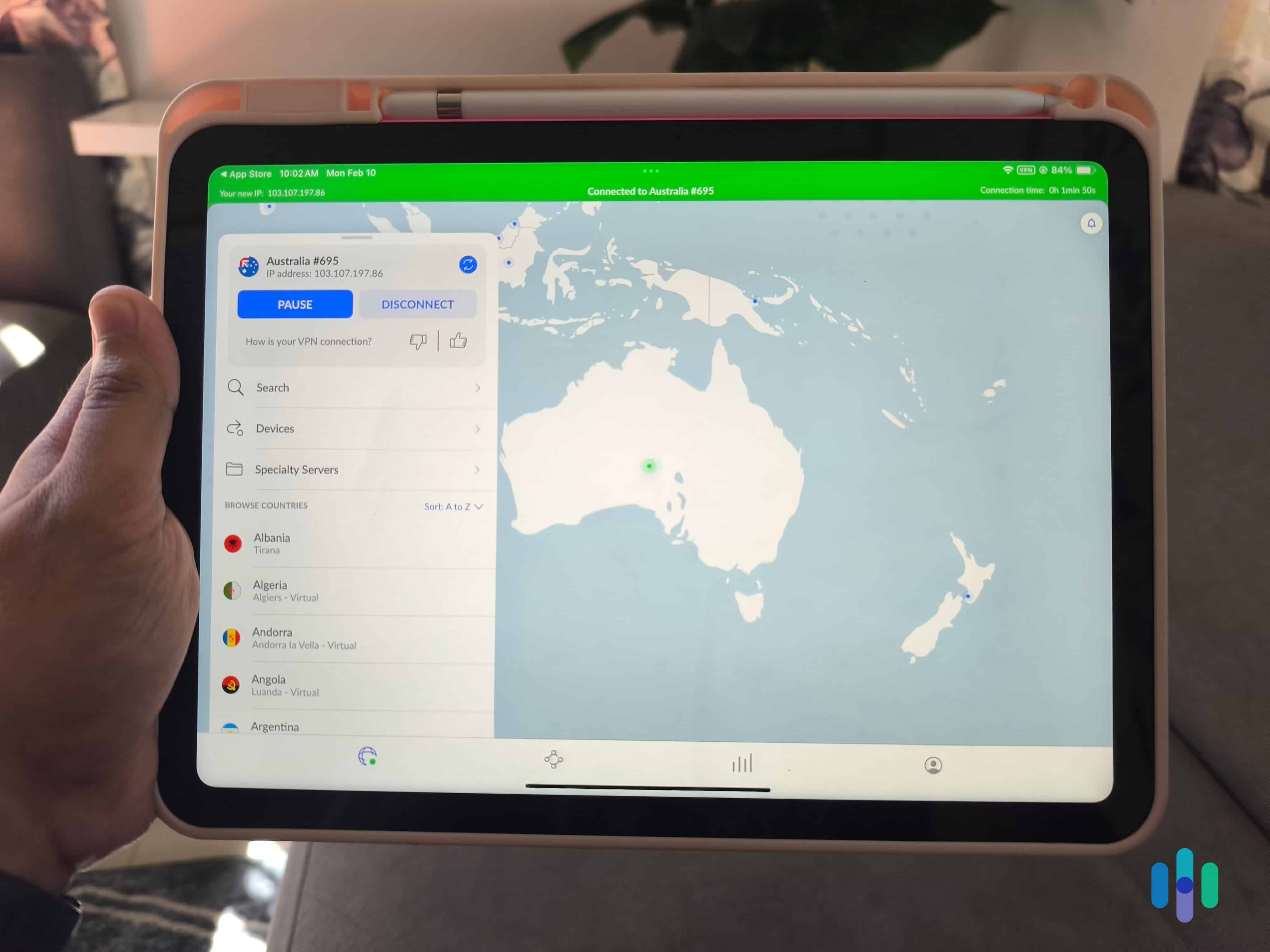 Our tester holding up an iPad connected to NordVPN’s Australia server